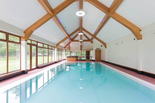 The indoor swimming pool is accessed via coded security door and has a feature ceiling, tinted glazed windows surrounding pool complex, double doors to garden area, hot tub, sauna, wc and changing area, music system and feature lighting.
