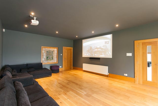 The cinema room with provisions for overhead projector and entertainment system is accessed from main hallway, leading to swimming pool complex.