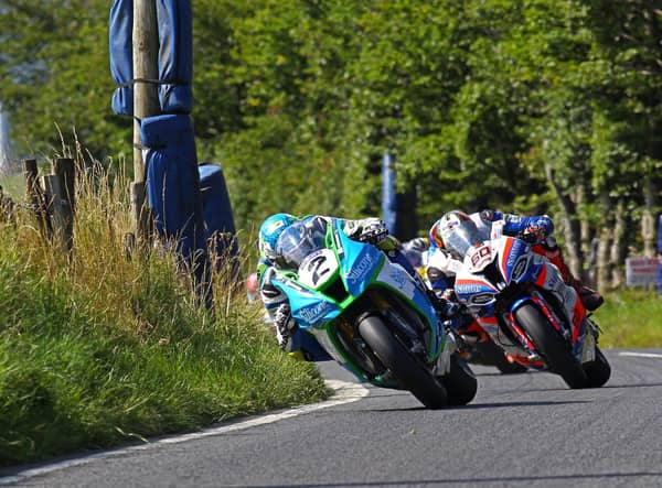 Dean Harrison (Silicone Engineering Kawasaki) leads Peter Hickman (Smiths BMW) at the Ulster Grand Prix in 2019.