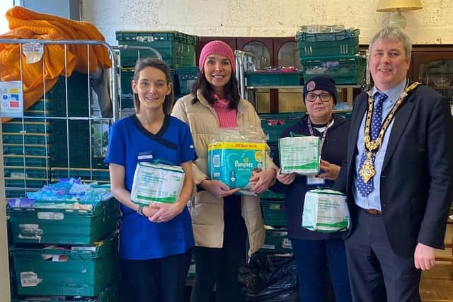 The Mayor of Causeway Coast and Glens Borough Council Councillor Richard Holmes pictured at the Community Rescue Service shop in Coleraine with Councillor Stephanie Quigley who led the organisation of donations in the Coleraine area and some of those who supported the local response to help those in need in Ukraine