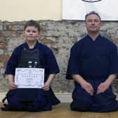 Aidan and Jack Gilmour with Martin Chambers Sensei, who presided over the grading panel, while visiting from England to attend the anniversary celebrations.