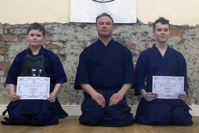 Aidan and Jack Gilmour with Martin Chambers Sensei, who presided over the grading panel, while visiting from England to attend the anniversary celebrations.