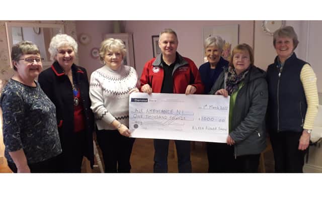 Kilrea Flower Show present £1000 to Air Ambulance NI (FROM LEFT) Maud Steele Chairperson, Jennifer Gardiner President Kilrea WI, Evelyn Kelso Treasurer, Dr Campbell Brown Air Ambulance NI, Elizabeth Moon Vice Chairperson, Sharon Moon Treasurer, Ann Laughlin Secretary