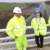 Minister Nichola Mallon is pictured with Juan Rodriguez-Altonaga Martinez (Contracts Manager) and Michael Troughton (Project Director) representing the Contractor Joint Venture of Sacyr, Wills Bros Ltd and Somague.