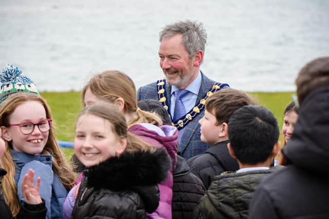 Schoolchildren and Mayor of Mid and East Antrim, Cllr William McCaughey at the path.