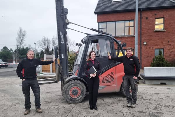 Moore Concrete’s human resources co-ordinator Áine Carey with
John Anderson (left) and Adam McConnell