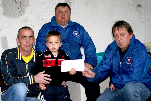 Anthony Kelly of AK Plastering, Balnamore, handing over a sponsorship cheque to Noel Anderson of Glebe Rangers under-14 team at Megaw Park last Thursday night. Also included is Tony Kelly and Jeremy McDowell.BM39-108JC.