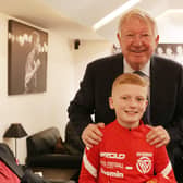 Ben Dickinson receives a hero's welcome at Old Trafford, led by former Manchester United manager Sir Alex Ferguson.