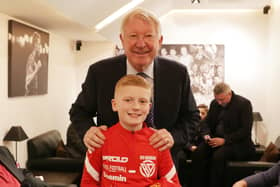 Ben Dickinson receives a hero's welcome at Old Trafford, led by former Manchester United manager Sir Alex Ferguson.