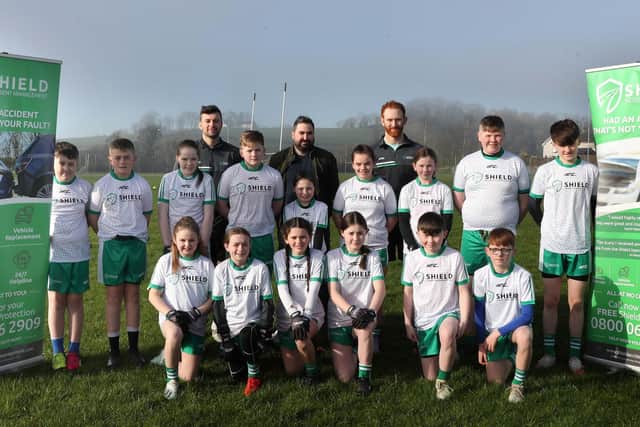 Sixteen children from across Northern Ireland were treated to an expert coaching session, hosted by two of GAA’s biggest stars, Conor McKenna and Conor Glass, after winning a Shield Accident Management (SAM) competition. Pictured with both players is Stephen McCann from Shield Accident Management (centre, back) and all of the winners from across Northern Ireland