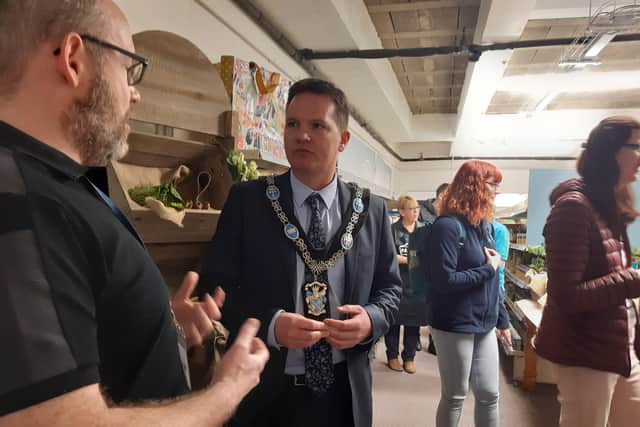 Chris Leech explains to Lord Mayor of Armagh, Banbridge and Craigavon Glenn Barr  how the social supermarket will work at the newly launched Freedom Foods Pantry in Lurgan.