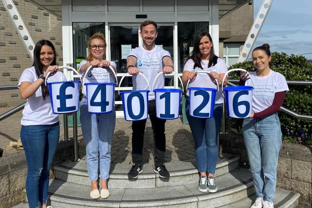 The Hospice Fundraising Team revealing the Big Bucket Collection total. A number of collections took place in Portadown, Lurgan, Armagh, Banbridge, Dungannon, Moy, Coalisland, Camlough, Crossmaglen, Kilkeel, Annalong, Newry, Rathfriland, Rostrevor and Warrenpoint with the total exceeding it’s original £30,000 aim.