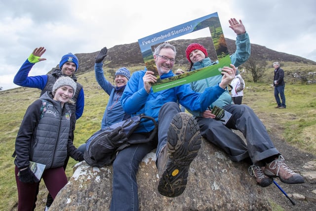Mayor of Mid and East Antrim, Councillor William McCaughey, with local people after completeing the St Patricks Day climb on Slemish mountain in Co Antrim