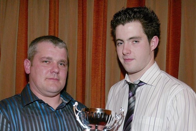 Ballinderry Shamrocks Reserve Player of the Year Kieran Hagan receives his award from team Manager Dominic Rocks.