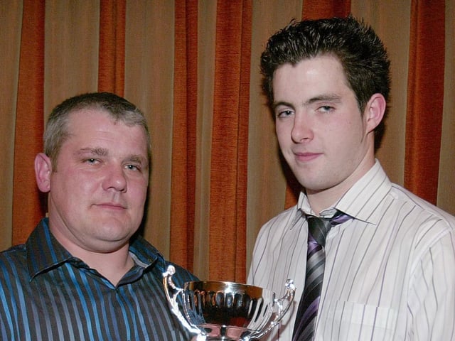 Ballinderry Shamrocks Reserve Player of the Year Kieran Hagan receives his award from team Manager Dominic Rocks.