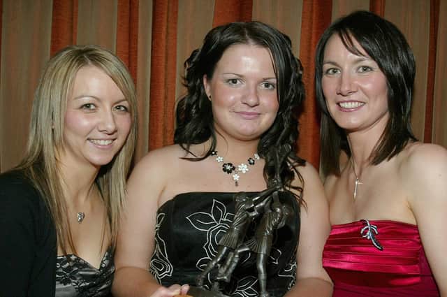 Sinead Conway receives the Patricia Bateson Memorial Trophy from Ann Marie and Paula  Bateson at the Ballinderry GAC presentation dinner in 2007.