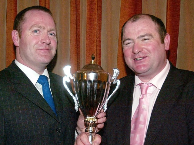 Martin McErlain presents the Ballinderry GFC Clubman of the Year award to Martin McKinless.