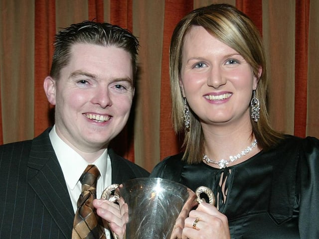 Ballinderry GFC Ladies Senior Player of the Year Martina Devlin receives the Siobhan Mullan Memorial Trophy from Colm Mullan.