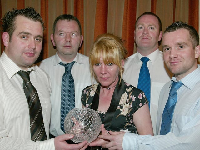 Ballinderry GFC made a special memorial award to the Mc Geehan Family in Memory of the late Martin Mc Geehan who had been the Secretary of the Club. Receiving the award is Martin's widow Susie, his sons Mark and Darren. Also pictured is his brother Eugene Chairman of the club and Martin McErlain Club Pro.