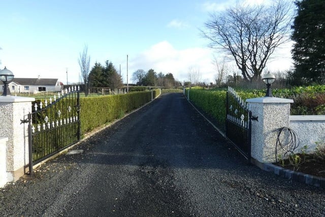 The property has a well maintained stoned driveway with decorative entrance gates