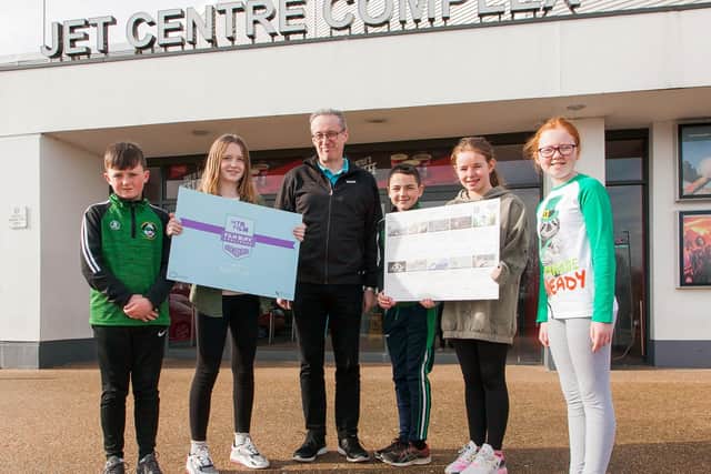 Winners of Into Film’s first Film Buff Challenge, St John’s Primary School in Dungiven, enjoyed the top prize of a free cinema trip to the Jet Centre in Coleraine. Pictured is teacher, Gary Lynch, who runs the school’s film club with (from left): Calvin, Sarah, Enda, Darcy and Aoife
