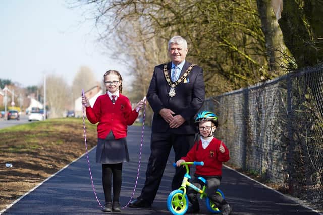 Mayor of Antrim and Newtownabbey, Cllr Billy Webb takes a walk along Ballyclare Greenway with pupils from Ballyclare Primary School.
