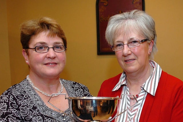 Derryloran Bowling Club ladies singles winner Olive Kyle receives her award from Mrs Janet Porteus at the club's presentation dinner held at the Braeside in 2010.