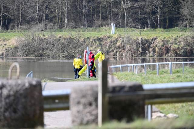 A large police presence pictured at Woodburn Dam in Carrickfergus on Monday. Picture: Pacemaker