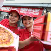 Apache Pizza is creating 400 new jobs with the opening of 20 new stores in Northern Ireland following a 32 percent increase in online pizza sales. Pictured celebrating the announcement are in-store team members, Neeyati Vaghela and Luciana Matos.  Pic Julien Behal Photography