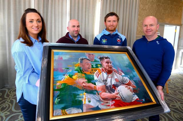 With the painting are  Emma Hughes, Martin McGirr, Owen Mulligan and  Peter Canavan.