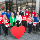 Pictured, from left, Hayley Lowry, Marketing Director, Keystone Group and Regina Cox, Partnerships Manager at NICHS with some of the Keystone Group employees taking part in the upcoming Belfast City Marathon.