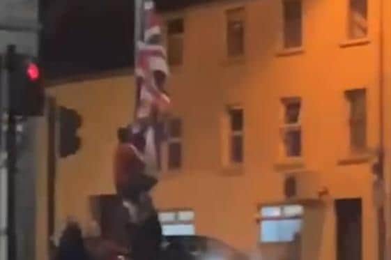 Union flag being removed at the Orrtor Street junction in Cookstown.