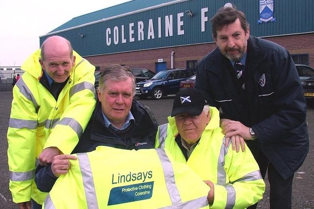 WARM GESTURE...Alan Lindsay of Lindsay's Protective Clothing and Footwear, Coleraine presents coats to Coleraine FC programme sellers Tommy Reid and Robbie Campbell. Also included is Hunter McClelland of the Garvagh, Kilrea and District Supporters' Club who produces the match day programme.CR13-308s