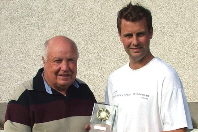 MAIN MAN...Ryan McLaughlin is presented with the Garvagh, Kilrea and District Supporters' Club Player of the Month award for August by sponsor Wilbert Marshall.CR39-314s