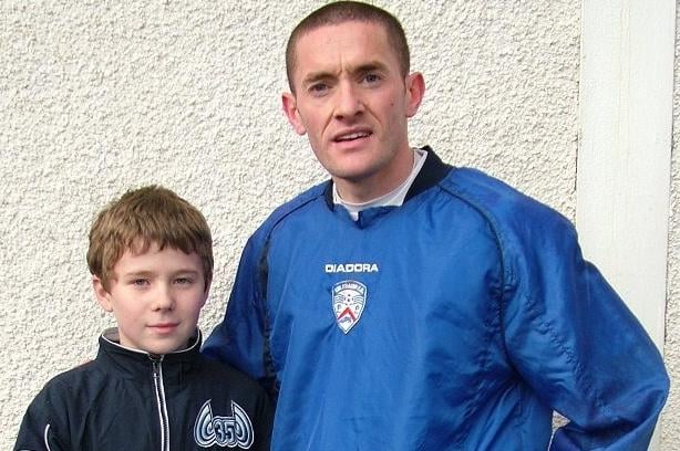 TOP MAN...Tommy McCallion is presented with the Garvagh, Kilrea and District Coleraine Supporters' Club Player of the Month for November by Gareth Ewart.CR51-266s