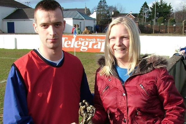 TOP MAN...Tracey Forgrave of the Garvagh, Kilrea and District Supporters' Club presents Darren Cassidy with the Player of the Month award for January.CR8-297s