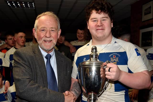 Dungannon captain, Fintan Loughran receives the Nutty Krust Cup from Brian Irwin, chairman of tournament sponsors, Irwin's Bakery. Photo by Tony Hendron