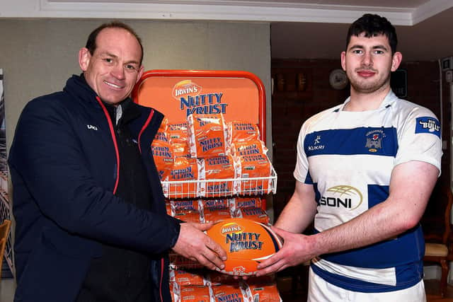 Dungannon's Ashley Doherty receives the man of the match award from Ireland star Simon Best. Photo by Tony Hendron