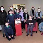 Deputy Chair of Mid Ulster District Council, Cllr. Christine McFlynn and Chair of Mid Ulster Loneliness Network, Sandra McKenna pictured with officers, staff, residents and pupils involved in the scheme.
