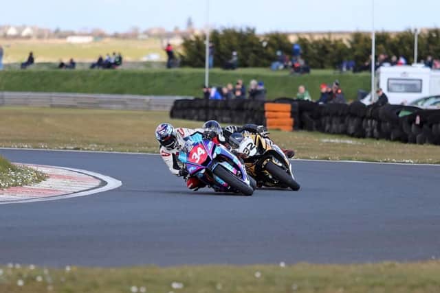 Carrickfergus man Alastair Seeley leads Lisburn’s  Carl Phillips in the second round of Superbike pro. Picture: J Henry