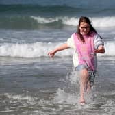 Enjoying the waves on Portrush West Strand. Picture: PressEye