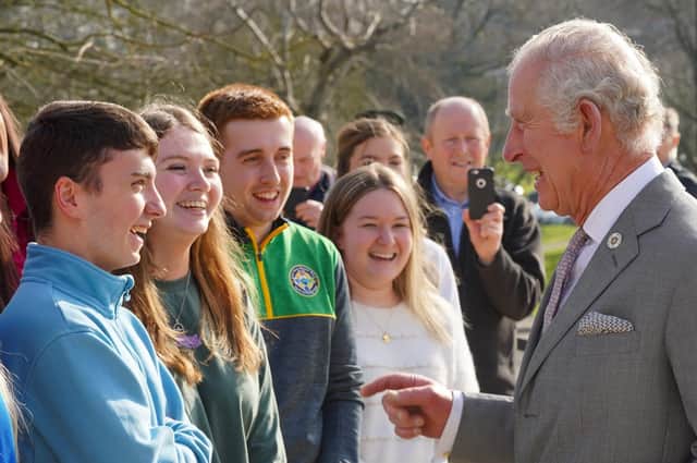 Lee Usher (in blue jacket) shares a joke with Prince Charles during a royal visit to Loughry College last month. Photo: Aaron McCracken