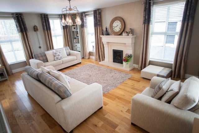 The attractive drawing room has a feature fireplace with gas fire.