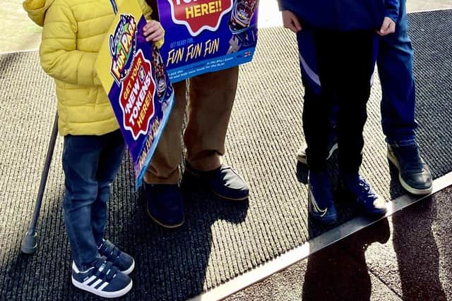 Rodney Byrne representing the RNLI and great grandson Jake, who goes to Portrush Primary School, officially opened Curry's Fun Park with owner Owen Curry and son Owen (junior)
