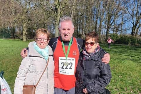 Cardiac arrest survivor, Frank McNally is supported by his sisters Anne Marie and Geraldine at his first 10km run since his collapse in March 2021.