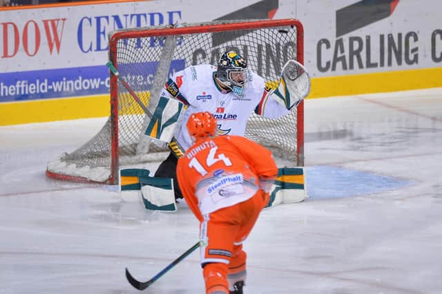 The puck flies over the glove of the Belfast Giants goalie Tyler Beskowarany during the dramatic game against the Sheffield Steelers which saw the Giants clinch the Elite League championship. Picture: Dean Woolley