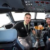 The Belfast Giants' David Goodwin and Tyler Beskorowany in the cockpit of the plane as they arrive at Belfast International Airport today after being crowned Premier Sports Elite League champions after defeating Sheffield Steelers yesterday. Pictured with the Elite League Trophy are   Photo by William Cherry/Presseye