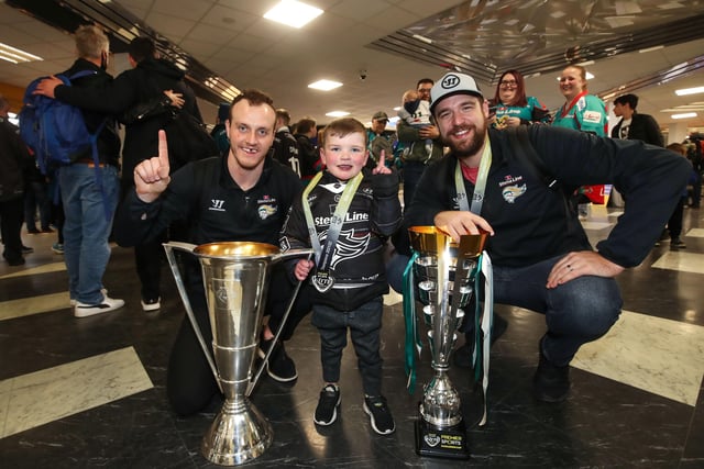 Belfast Giants Mark Cooper and Tyler Beskorowany with Dáithí’ Mac Gabhann as they arrive at Belfast International Airport today after being crowned Premier Sports Elite League champions after defeating Sheffield Steelers yesterday.    Photo by William Cherry/Presseye