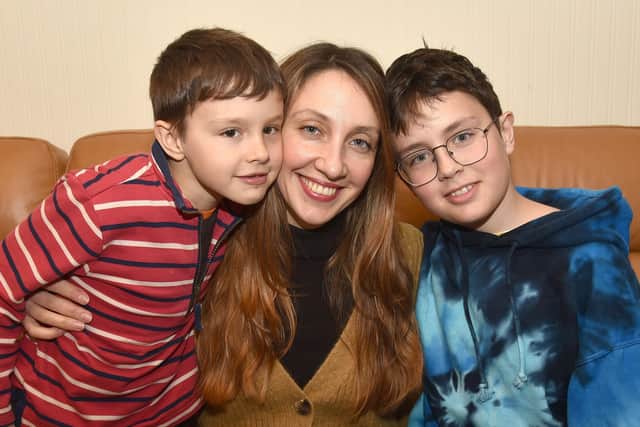 Ukranian woman, Maryna Opanasenko pictured with her children, Bohdan (6) and Taras (12) at her mother's home in Richhill following their escape from Kyiv. INPT15-200.