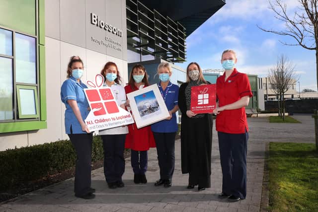 Pictured are Craigavon Area Hospital Staff Nurse Megan Mc Dowell; Student Nurse Lauren McCorry; Northern Ireland Children to Lapland Trust (NICLT) General Manager Fiona Williamson; Deputy Ward Sister Faith Farrell; Wineflair (one of the charity’s corporate partners) MD Andrea Carson; and Acting Ward Manager Dianna Symington.